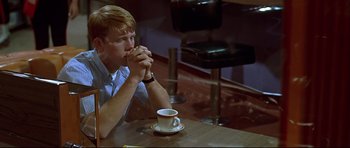 Movie still from “American Graffiti” (1973), directed by George Lucas – Medium shot, High angle