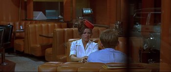 Movie still from “American Graffiti” (1973), directed by George Lucas – Medium shot, Over the shoulder angle