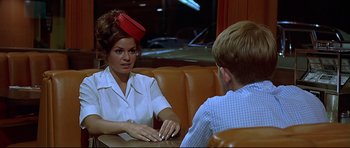 Movie still from “American Graffiti” (1973), directed by George Lucas – Medium shot, Over the shoulder angle