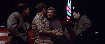 Movie still from “American Graffiti” (1973), directed by George Lucas – Medium shot, Over the shoulder angle
