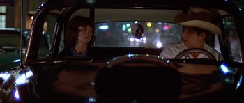 Movie still from “American Graffiti” (1973), directed by George Lucas – Medium shot, Over the shoulder angle