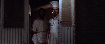 Movie still from “American Graffiti” (1973), directed by George Lucas – Medium shot, Low angle