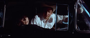 Movie still from “American Graffiti” (1973), directed by George Lucas – Close Up shot, Over the shoulder angle