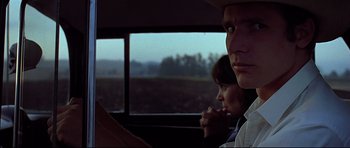 Movie still from “American Graffiti” (1973), directed by George Lucas – Close Up shot, Over the shoulder angle