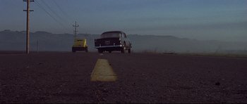 Movie still from “American Graffiti” (1973), directed by George Lucas – Wide shot, Low angle