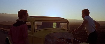Movie still from “American Graffiti” (1973), directed by George Lucas – Wide shot, Low angle
