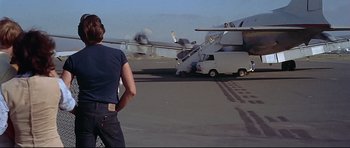 Movie still from “American Graffiti” (1973), directed by George Lucas – Wide shot, Over the shoulder angle