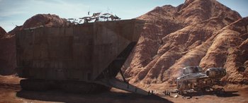 Movie still from “The Mandalorian” (2019), created by Jon Favreau – People are standing on the side of an abandoned ship; Extreme Wide shot, Low angle