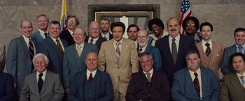 A group of men in suits posing for a picture