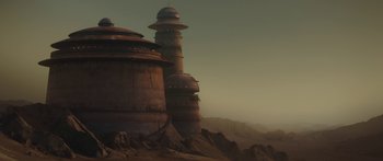 Movie still from “The Mandalorian” (2019), created by Jon Favreau – An image of an old building in the middle of the desert; Extreme Wide shot, Low angle