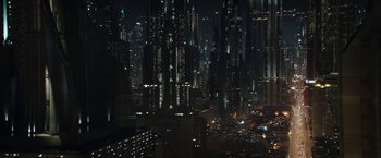 Movie still from “The Mandalorian” (2019), created by Jon Favreau – A view of a city at night from above; Extreme Wide shot, High angle