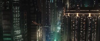 Movie still from “The Mandalorian” (2019), created by Jon Favreau – A view of a city at night from a skyscraper; Extreme Wide shot, Overhead angle