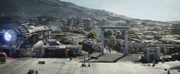 Movie still from “The Mandalorian” (2019), created by Jon Favreau – An aerial view of an area with people walking on the ground; Extreme Wide shot, High angle