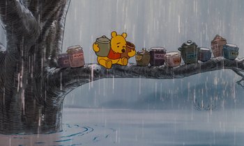 Movie still from “The Many Adventures of Winnie the Pooh” (1977), directed by John Lounsbery – Winnie the pooh sitting on a tree branch in the pouring rain; Wide shot, Low angle