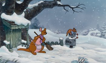 Movie still from “The Many Adventures of Winnie the Pooh” (1977), directed by John Lounsbery – A painting of two animals in the snow; Wide shot, High angle