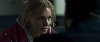 Movie still from “The Marco Effect” (2021), directed by Martin Zandvliet – A woman sitting in front of a laptop computer; Close Up shot, Over the shoulder angle