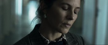Movie still from “The Marco Effect” (2021), directed by Martin Zandvliet – A person with her eyes closed; Close Up shot, Low angle