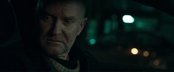 Movie still from “The Marco Effect” (2021), directed by Martin Zandvliet – A person looking at the camera; Close Up shot, Over the shoulder angle