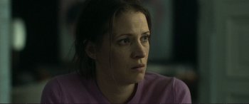 Movie still from “The Marco Effect” (2021), directed by Martin Zandvliet – A person wearing a purple shirt; Close Up shot, Over the shoulder angle