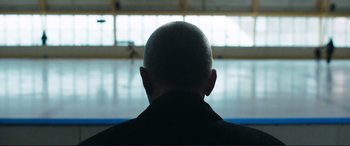 Movie still from “The Marco Effect” (2021), directed by Martin Zandvliet – A man sitting in front of an open window; Close Up shot, Over the shoulder angle