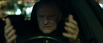 Movie still from “The Marco Effect” (2021), directed by Martin Zandvliet – A person driving a car; Close Up shot, Low angle