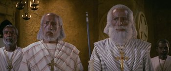 Movie still from “The Message” (1976), directed by Moustapha Akkad – A couple of men standing next to each other; Close Up shot, Low angle