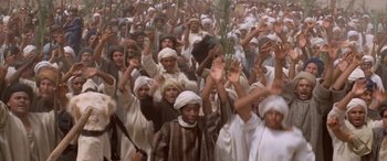 Movie still from “The Message” (1976), directed by Moustapha Akkad – A large group of people are gathered together; Wide shot, High angle