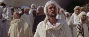 Movie still from “The Message” (1976), directed by Moustapha Akkad – A group of men in white robes and white hats; Medium shot, Low angle