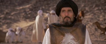 Movie still from “The Message” (1976), directed by Moustapha Akkad – A man with a beard wearing a turban; Medium shot, Low angle