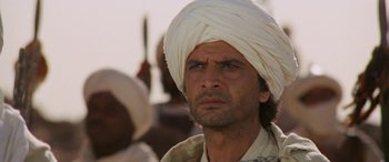 Movie still from “The Message” (1976), directed by Moustapha Akkad – A person wearing a turban; Close Up shot, Low angle