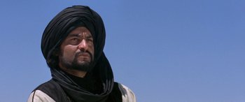 Movie still from “The Message” (1976), directed by Moustapha Akkad – A person wearing a turban; Close Up shot, Low angle