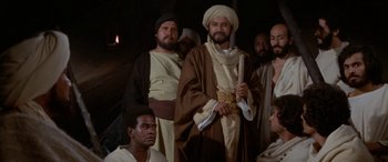 Movie still from “The Message” (1976), directed by Moustapha Akkad – A group of men standing next to each other; Medium shot, Low angle