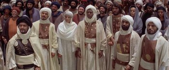Movie still from “The Message” (1976), directed by Moustapha Akkad – A large group of men and women standing together; Wide shot, High angle