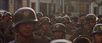 Movie still from “The Moment of Truth” (1965), directed by Francesco Rosi – A group of men in military fatigues and helmets; Medium shot, High angle
