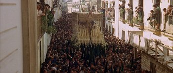 Movie still from “The Moment of Truth” (1965), directed by Francesco Rosi – A crowd of people walking down a street; Extreme Wide shot, High angle