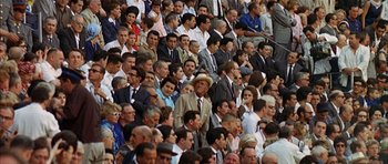 Movie still from “The Moment of Truth” (1965), directed by Francesco Rosi – A crowd of people sitting in the stands at an event; Wide shot, High angle