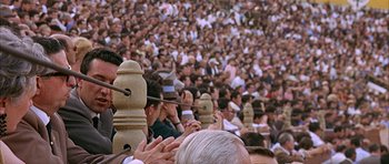 Movie still from “The Moment of Truth” (1965), directed by Francesco Rosi – A large crowd of people gathered in a stadium; Close Up shot, High angle
