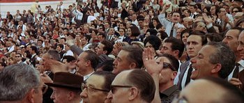 Movie still from “The Moment of Truth” (1965), directed by Francesco Rosi – A crowd of people sitting and standing in a stadium; Extreme Wide shot, High angle