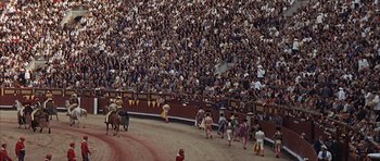 Movie still from “The Moment of Truth” (1965), directed by Francesco Rosi – A group of people riding on the back of a horse; Extreme Wide shot, High angle