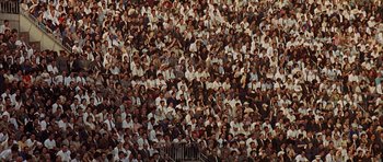 Movie still from “The Moment of Truth” (1965), directed by Francesco Rosi – A crowd of people sitting in a stadium; Extreme Wide shot, High angle
