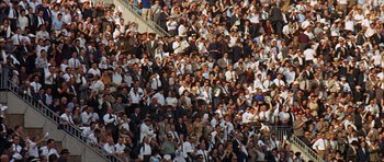 Movie still from “The Moment of Truth” (1965), directed by Francesco Rosi – A crowd of people standing in a stadium; Extreme Wide shot, High angle