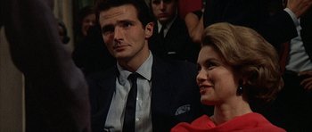 Movie still from “The Moment of Truth” (1965), directed by Francesco Rosi – A man and a woman are sitting in front of each other; Close Up shot, Over the shoulder angle