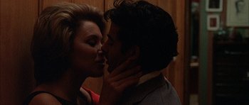 Movie still from “The Moment of Truth” (1965), directed by Francesco Rosi – A man and a woman kissing in the dark; Close Up shot, Over the shoulder angle