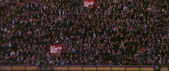 Movie still from “The Moment of Truth” (1965), directed by Francesco Rosi – A large crowd of people in a stadium watching a baseball game; Extreme Wide shot, High angle