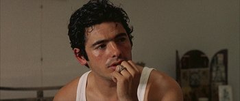 Movie still from “The Moment of Truth” (1965), directed by Francesco Rosi – A person with a ring on his finger; Close Up shot, Over the shoulder angle