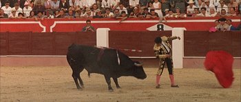 Movie still from “The Moment of Truth” (1965), directed by Francesco Rosi – Two men are fighting in front of an audience; Extreme Wide shot, High angle