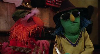Movie still from “The Muppet Movie” (1979), directed by James Frawley – A couple of muppets are standing next to each other; Close Up shot, Low angle