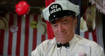 Movie still from “The Muppet Movie” (1979), directed by James Frawley – An older man wearing an ice cream hat; Close Up shot, Over the shoulder angle