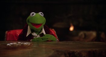 Movie still from “The Muppet Movie” (1979), directed by James Frawley – A kermit the frog puppet; Medium shot, Low angle