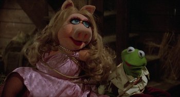 Movie still from “The Muppet Movie” (1979), directed by James Frawley – A couple of people that are sitting next to each other; Close Up shot, High angle